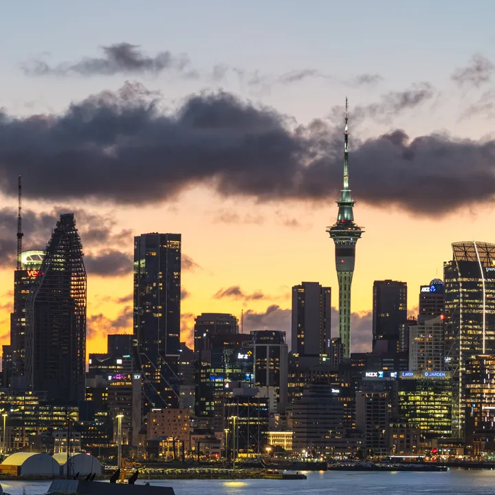 The finished puzzle: the Auckland skyline across the harbour at the blue hour, the Sky Tower lit
