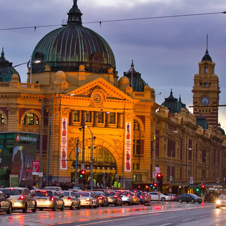 The finished puzzle: Flinders Street Station at dusk, its dome and clock tower lit gold